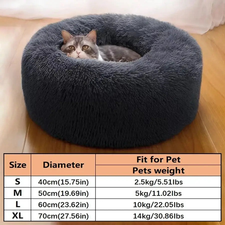 A plush round calming pet bed for cats and small dogs in dark gray with a soft fluffy texture