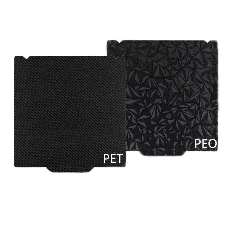 Two black rectangular 330x315mm pet pei build plates for Sidewinder X4 Plus with carbon fiber and 3d geometric textures