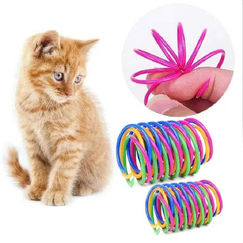 Brightly colored plastic cat spring toys with flexible pink blue green and yellow coil rings for interactive pet play