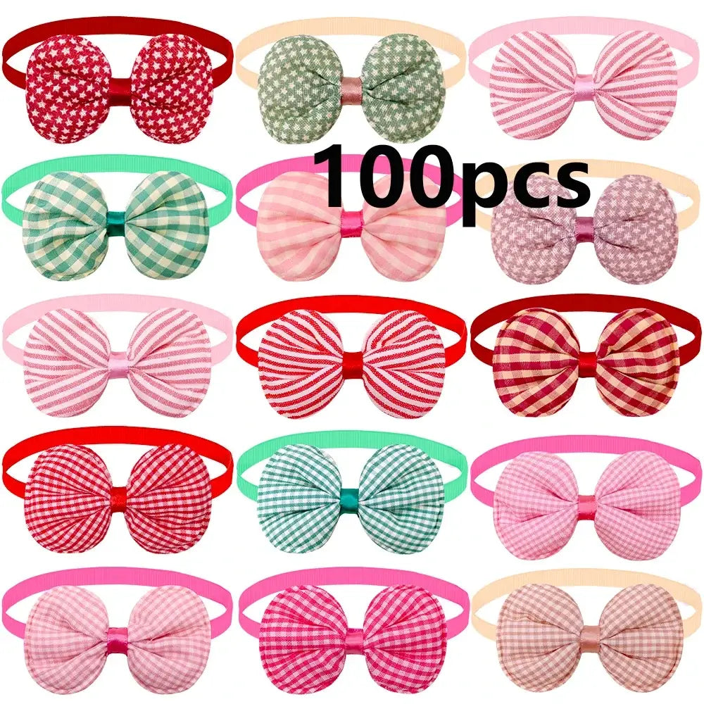 A collection of colorful fabric bow headbands in solid and checkered patterns for small dog and cat fashion accessories