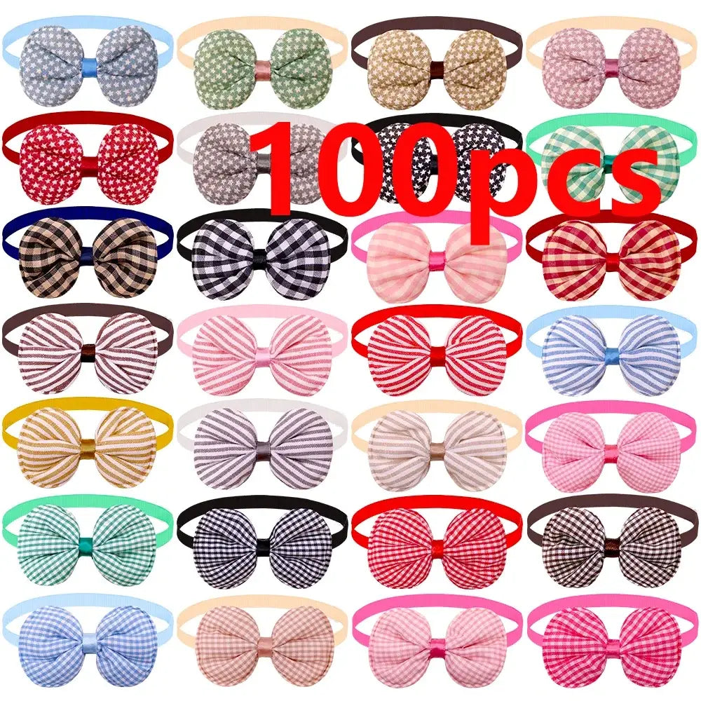 A collection of 100 colorful patterned small dog bow headbands in various fabrics for pet grooming and fashion accessories