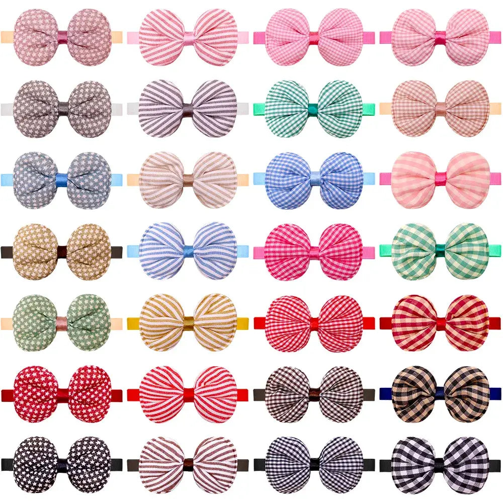A collection of colorful patterned fabric bows with elastic bands for small dog cat bow tie collar accessories