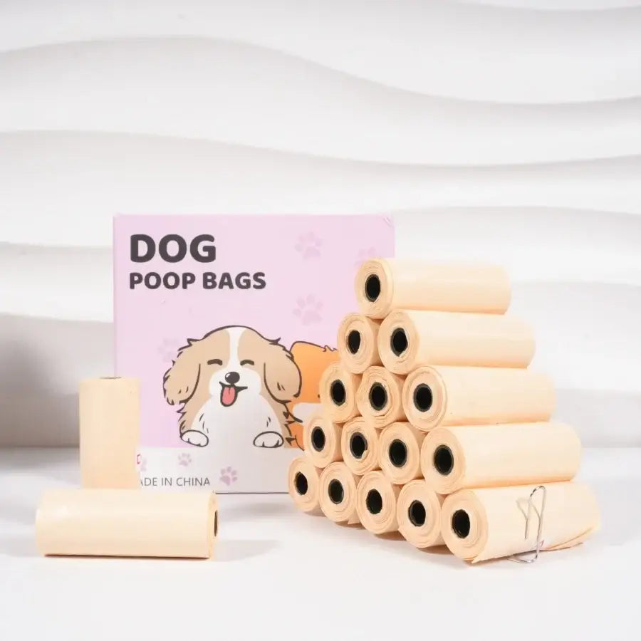 Beige plastic dog poop bags stacked beside pink cartoon packaging for 75 150 300 counts pet waste bags with dispenser and clip