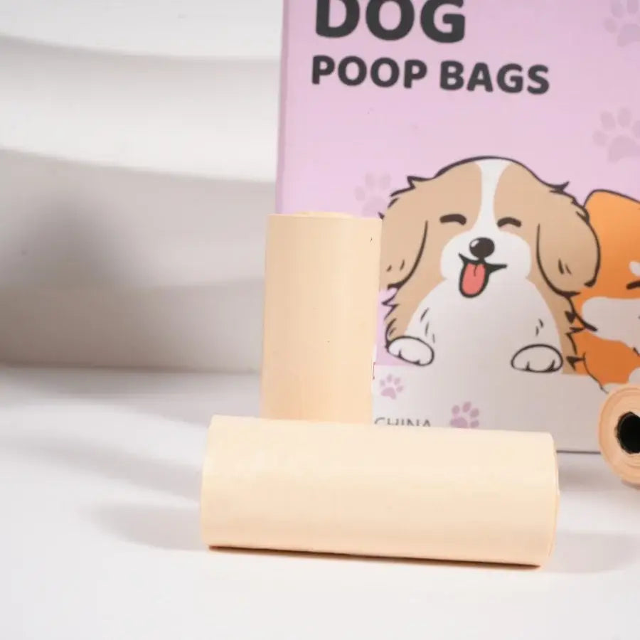 Beige roll of thickened unscented dog poop bags with cartoon puppy design for walking with dispenser and leash clip