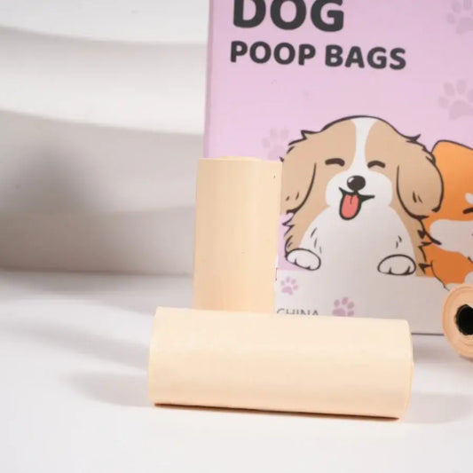 Beige roll of thickened unscented dog poop bags with cartoon puppy design for walking with dispenser and leash clip