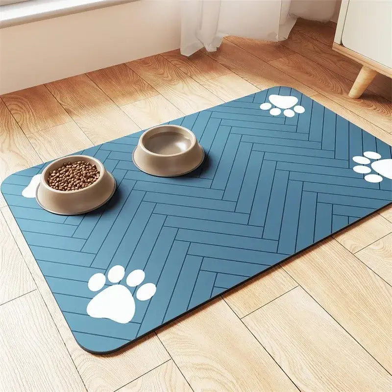 Blue herringbone absorbent quick dry pet feeding mat with white paw print decals for easy cleaning and spill control