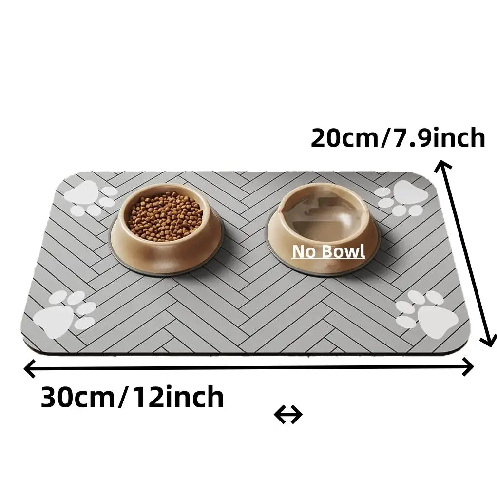 Gray herringbone absorbent waterproof pet feeding mat with white paw prints and two beige bowls for kibble and water