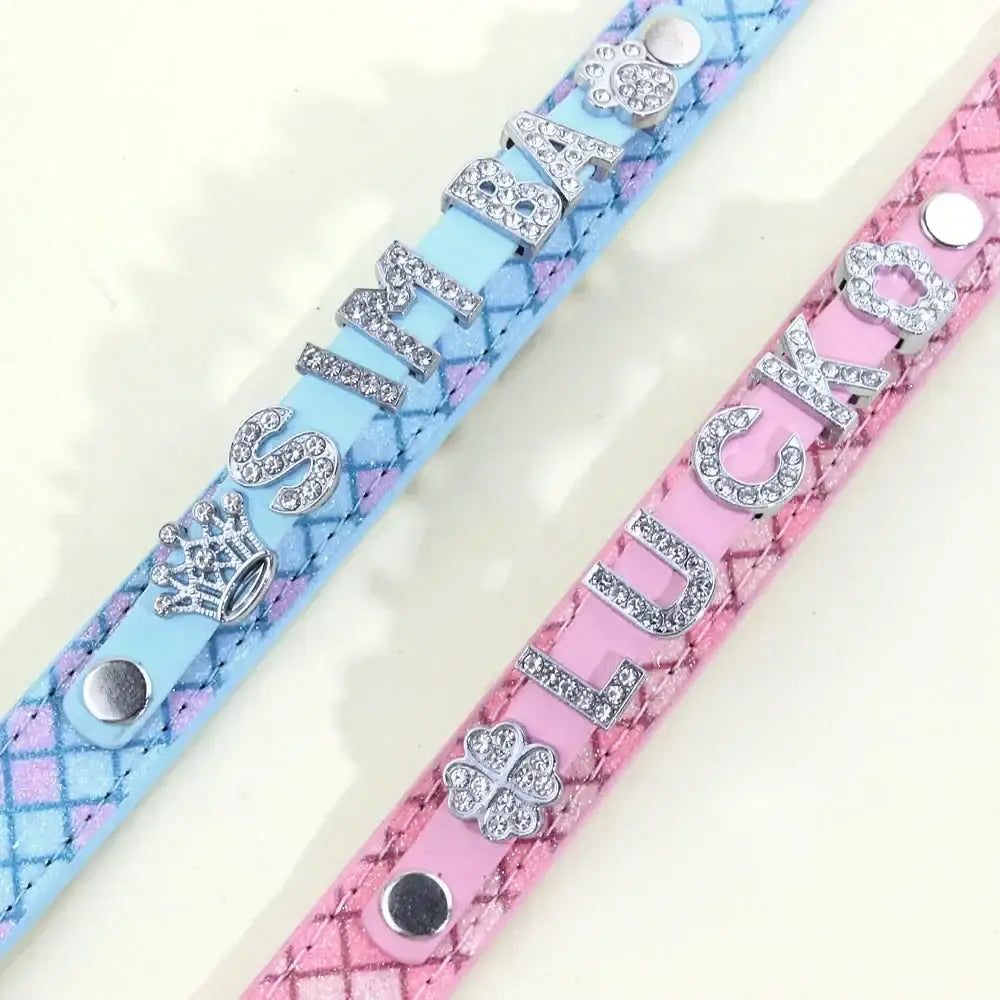 Two decorative bling rhinestone puppy dog collars in light blue and pink quilted leather with personalized silver charms