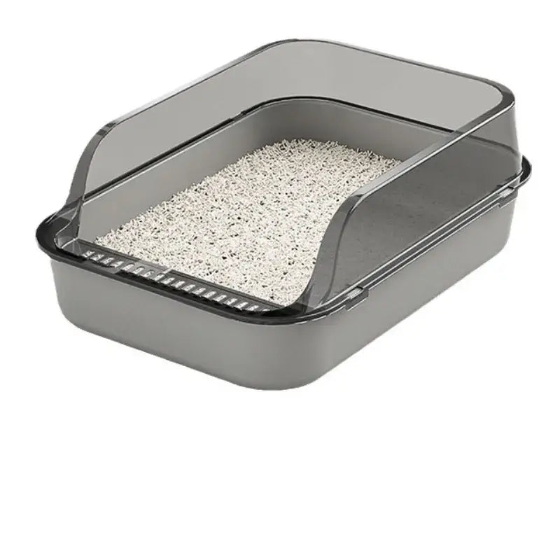 Gray plastic cat litter box with clear lid high fence and white speckled litter for splash-proof outdoor use