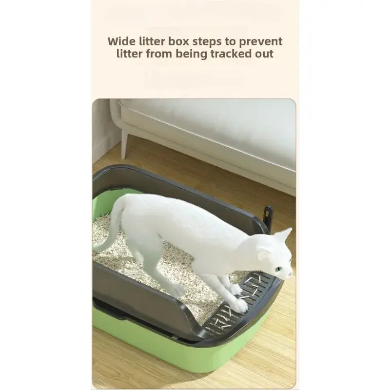 Green and black cat litter box with high fence and wide steps for splash proof use outdoors