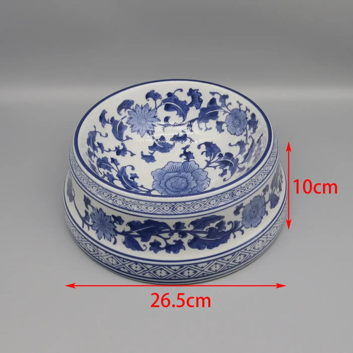 Ceramic pet feeding bowl with a classic blue and white porcelain design featuring intricate floral patterns and glossy finish