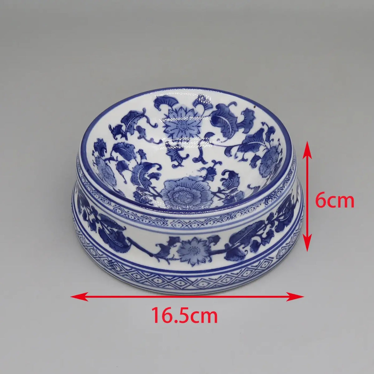 Ceramic pet feeding bowl in classic blue and white porcelain with intricate floral patterns and a decorative rim