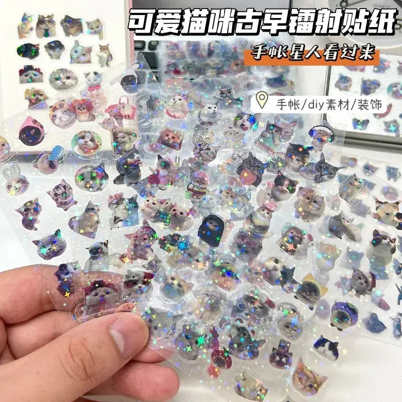 A clear transparent sheet of glitter waterproof cat laser scrapbook sticker paper with cute cat illustrations and star accents