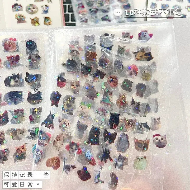 Clear plastic sheets of glitter waterproof cat laser scrapbook stickers featuring colorful cats in various poses and outfits