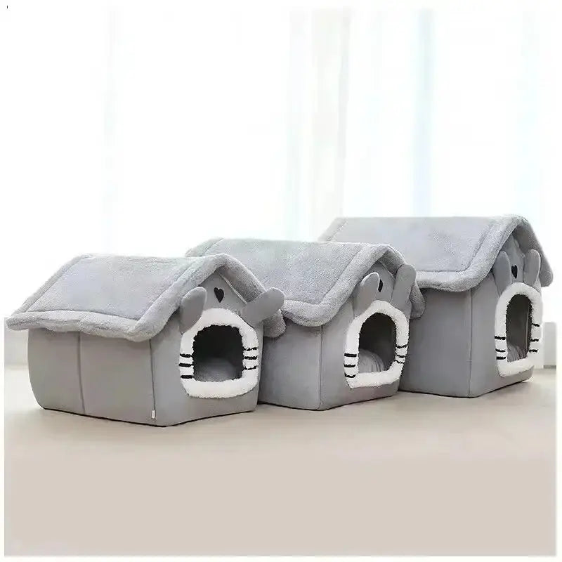 Gray plush indoor dog house with soft fuzzy roof white-trimmed entrance and black whisker details cozy pet bed tent