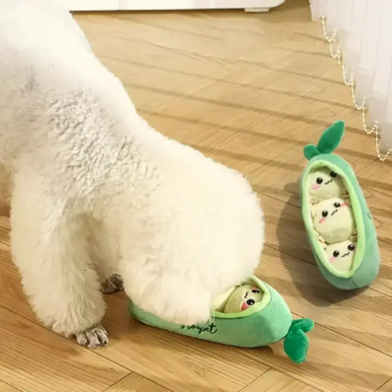 Green pea-shaped plush pet toy with three cartoon faces inside soft bite-resistant interactive dog puzzle toy
