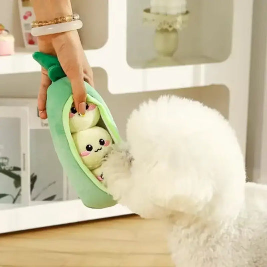 Green plush pea pod pet toy with two white stuffed peas, squeaky, bite-resistant, and interactive for dogs