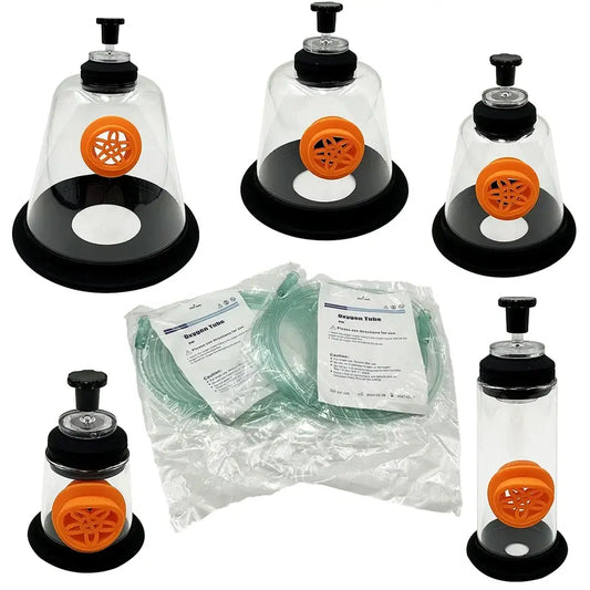 Set of three transparent glass suction cups with black bases and orange valves with packaged oxygen tubing for pet mask kit