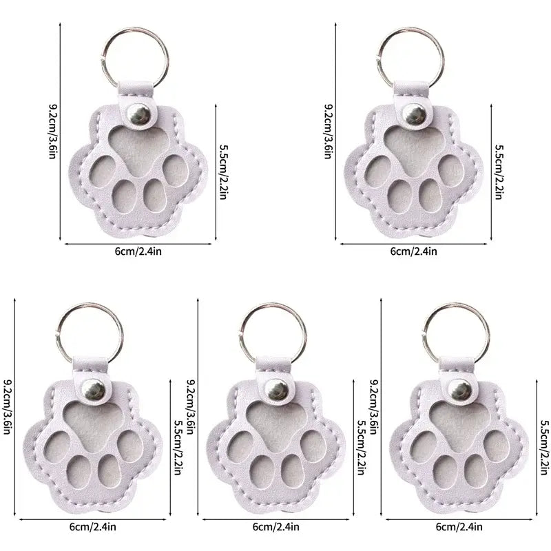 Light purple leather paw print keychain with stitched edges and silver ring for pet fur memorial keepsake and hair storage