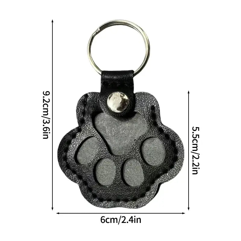 Black leather pet fur memorial keepsake keychain with paw print silver metal ring and snap button hair storage bag