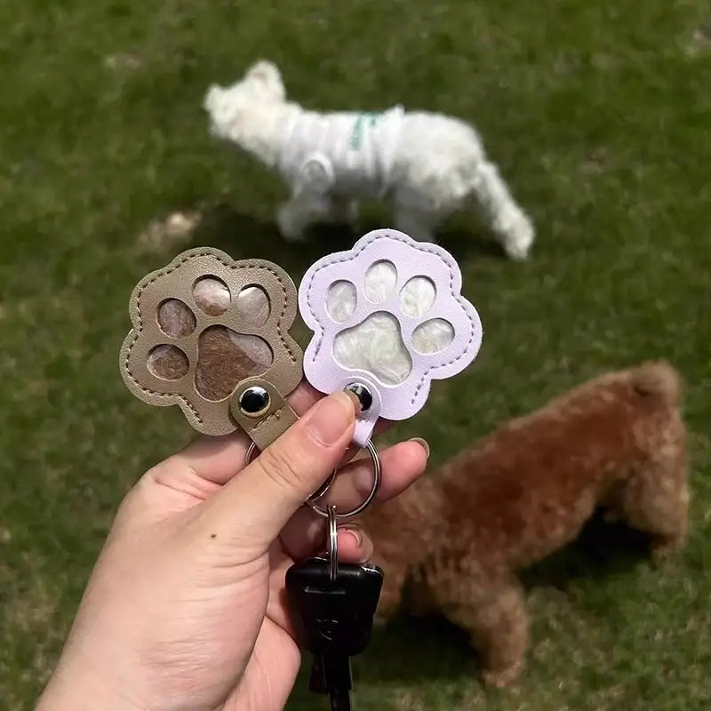 Pet fur memorial keepsake keychain and hair storage bag in tan leather and light purple faux leather with clear windows