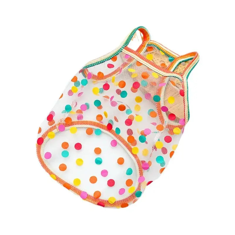 A transparent mesh pet vest with colorful orange yellow pink and teal polka dots for dogs and cats