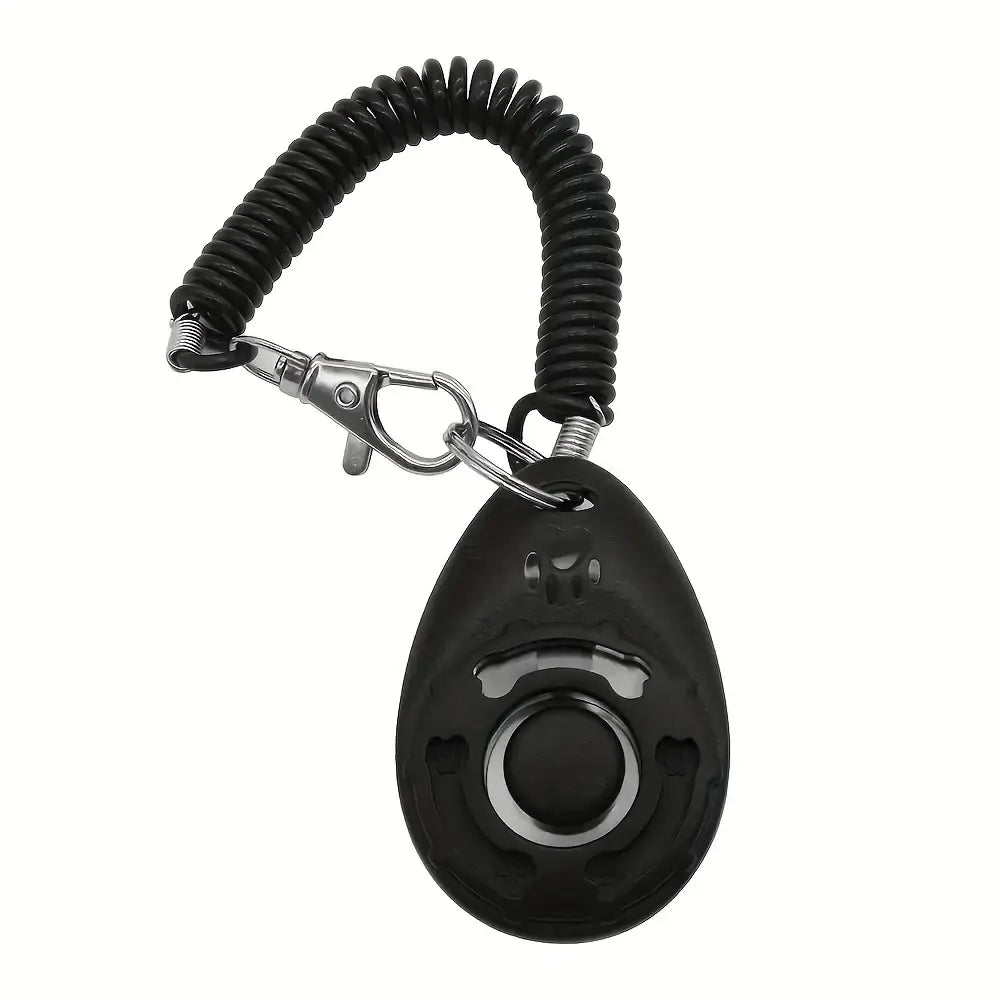 Black silicone dog training clicker with coiled keychain and silver metal clasp for behavior and potty training
