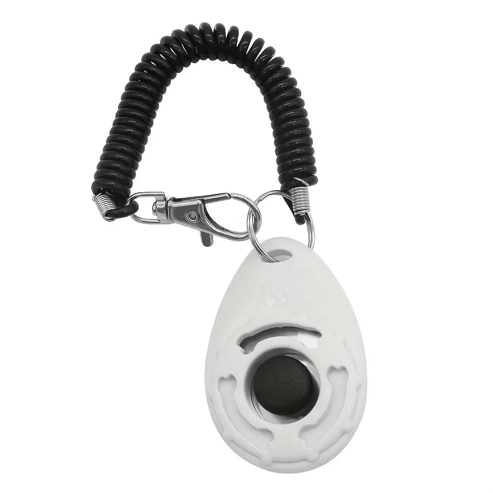 White plastic pet training clicker with black button and coiled keychain for dog behavior and potty training