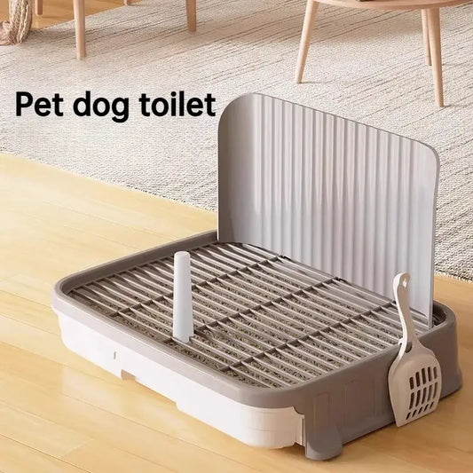 Gray and white plastic dog pee pad holder with ribbed privacy screen slatted tray and attached scoop for training