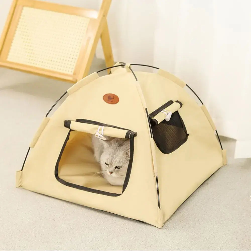 Beige portable foldable cotton cat tent house with black trim and mesh side pocket for camping style use