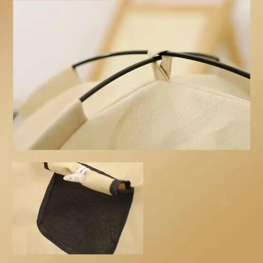 Beige canvas portable foldable cotton cat tent house with black metal frame and mesh side pocket for laundry storage