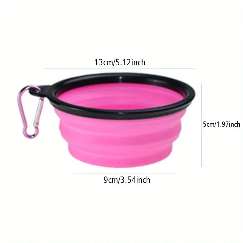 Portable silicone dog folding travel bowl in pink with black rim and pink carabiner clip for easy carrying