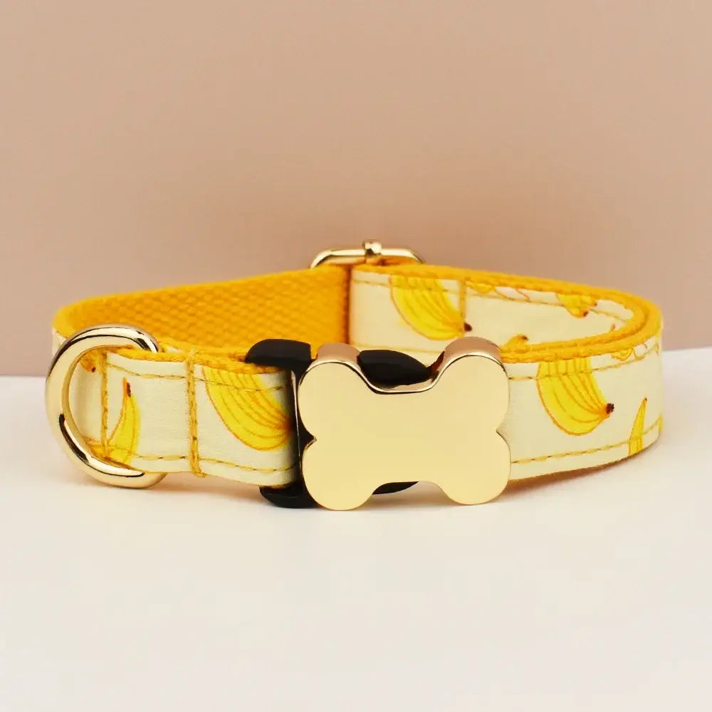 Yellow banana-patterned premium custom engraved dog collar with gold-tone bone buckle and matching metal ring for pets