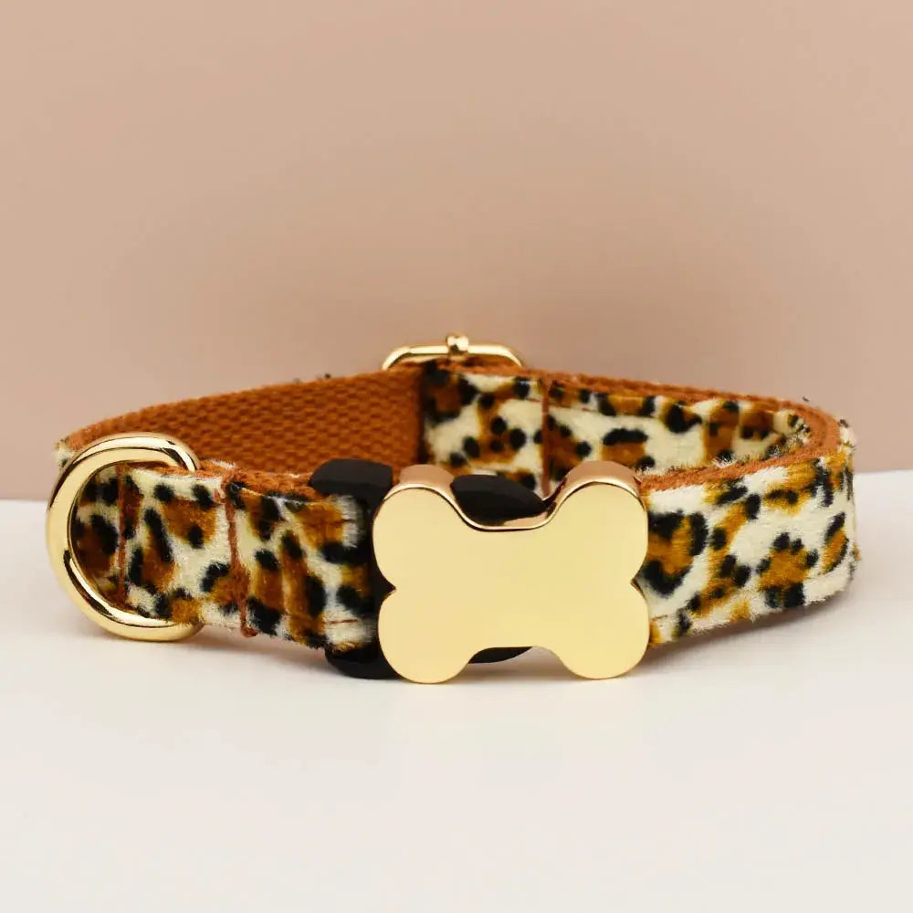 Premium custom engraved leopard-print dog collar with gold-tone bone-shaped buckle and matching d-ring for pets
