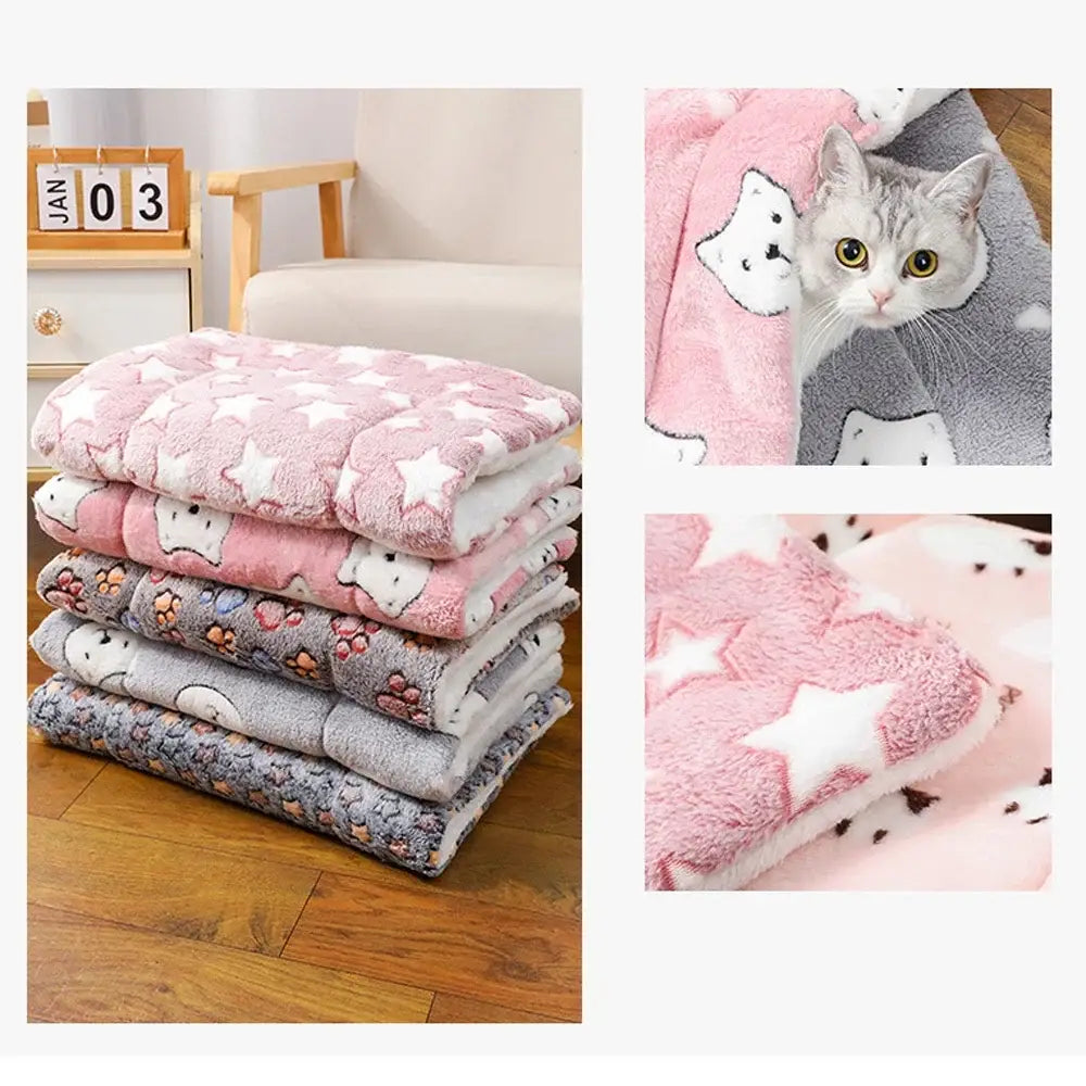 Stack of soft flannel thickened pet fleece blankets in pink and gray with cat star and paw print patterns for pets
