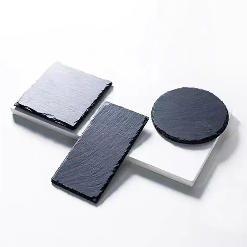 Black slate coasters in square rectangular and circular shapes with natural texture for tortoise slab mat use