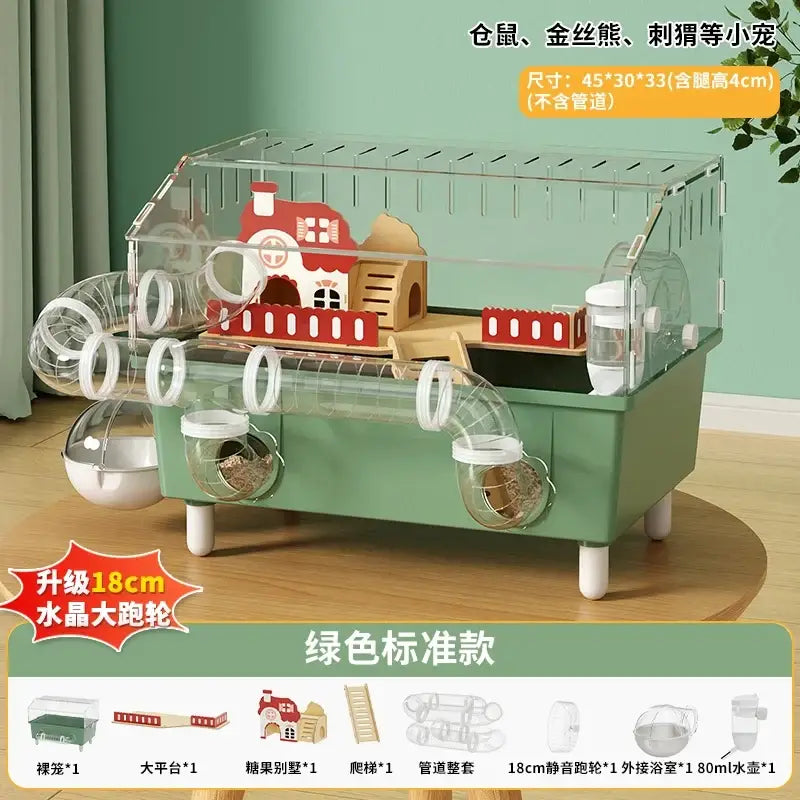 Green plastic hamster habitat with clear acrylic sides and top featuring red-roofed house, tunnels, and white wheels