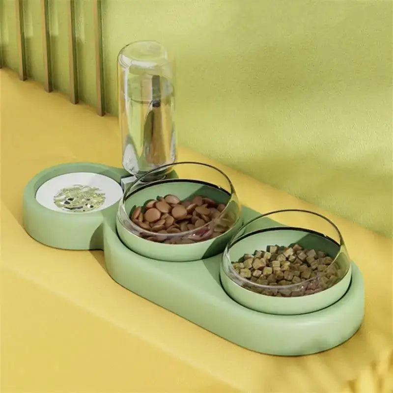 Mint green triple bowl automatic pet feeder with two glass bowls and a clear water dispenser for pet hydration