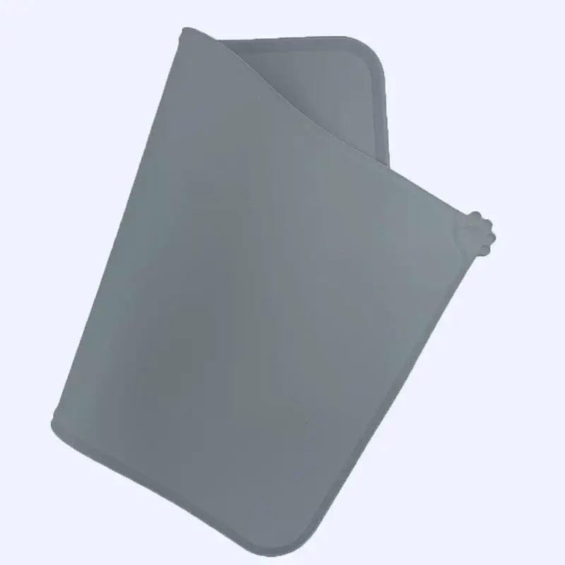 Gray silicone waterproof pet feeding mat with soft flexible texture and rounded edges for easy cleaning